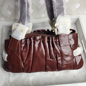 The find Chocolate Brown Leather Barrel shoulder bag with gold hardware